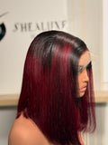 A 10" bone straight wig with dark roots and burgundy highlights perfect for women who like bold color