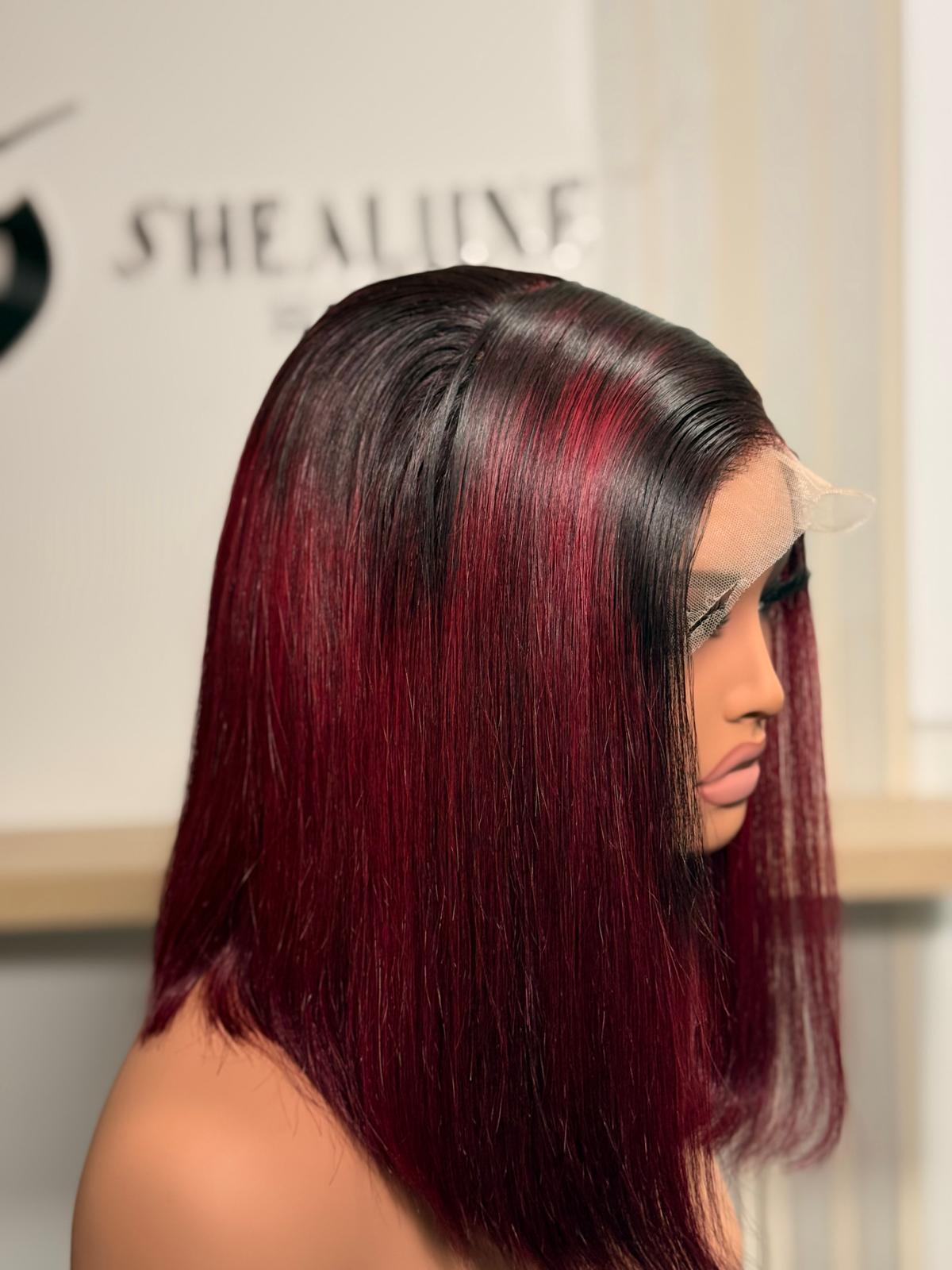 A 10" bone straight wig with dark roots and burgundy highlights perfect for women who like bold color